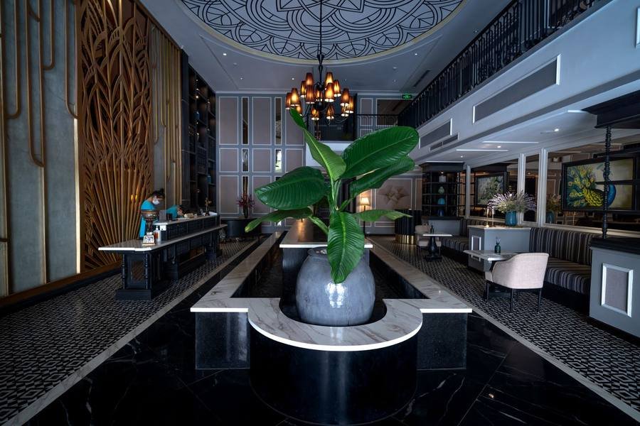 Elegant elevator lobby with gold cabin doors